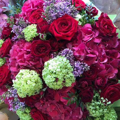 Beautiful bouquet of hydrangeas and red roses